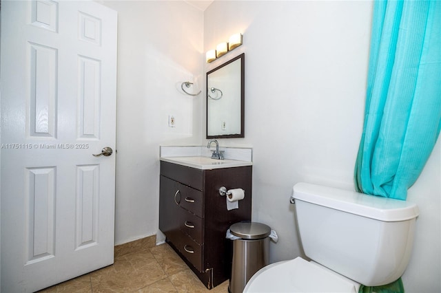 half bathroom featuring toilet and vanity