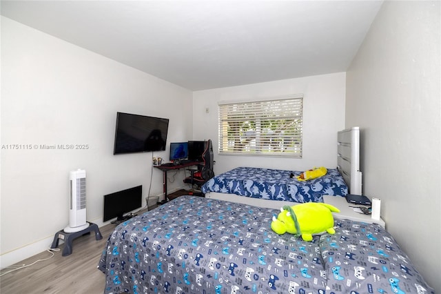 bedroom with light wood-style floors