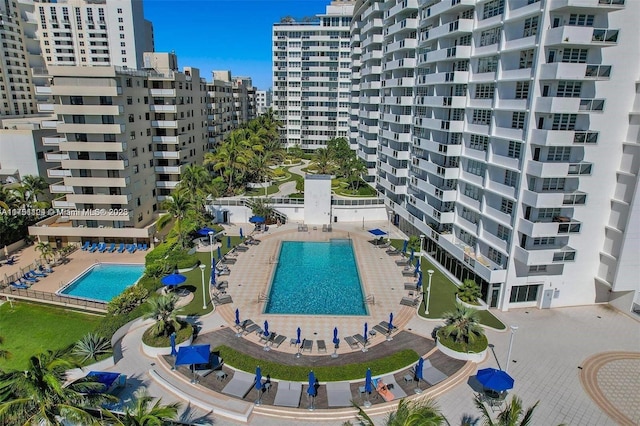 view of pool with a city view