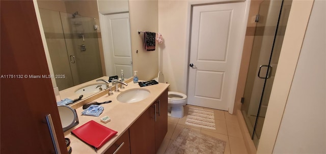 1945 S Ocean Dr Unit 701, Hallandale Beach, FL 33009 - bathroom featuring a shower stall, tile patterned floors, toilet, and vanity
