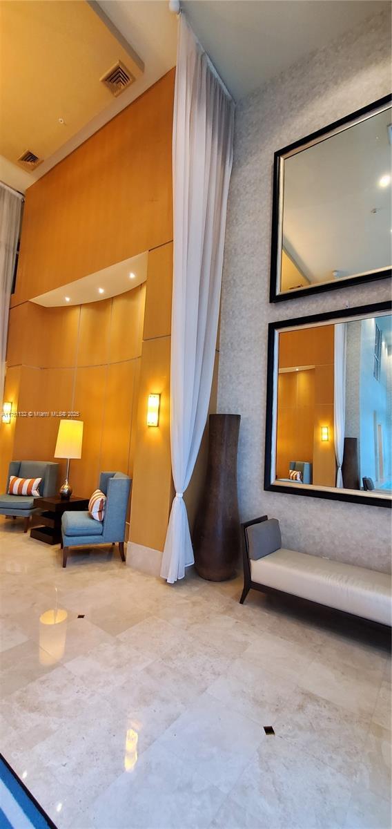 1945 S Ocean Dr Unit 701, Hallandale Beach, FL 33009 - sitting room with a high ceiling and visible vents