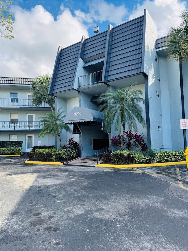 9200 Lime Bay Blvd Unit 212, Tamarac, FL 33321 - view of property featuring uncovered parking