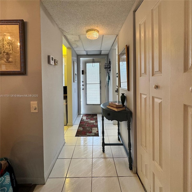 9200 Lime Bay Blvd Unit 212, Tamarac, FL 33321 - interior space with a paneled ceiling, baseboards, and light tile patterned floors