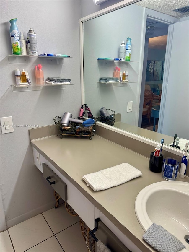 bathroom with vanity, visible vents, and tile patterned floors