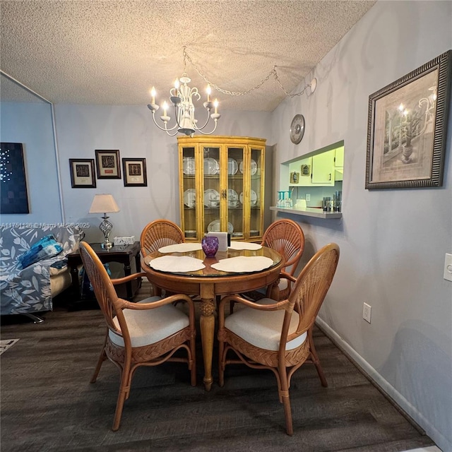9200 Lime Bay Blvd Unit 212, Tamarac, FL 33321 - dining space featuring dark wood finished floors, an inviting chandelier, and a textured ceiling