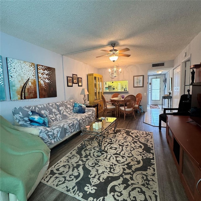 9200 Lime Bay Blvd Unit 212, Tamarac, FL 33321 - living room with a textured ceiling, wood finished floors, visible vents, and ceiling fan with notable chandelier