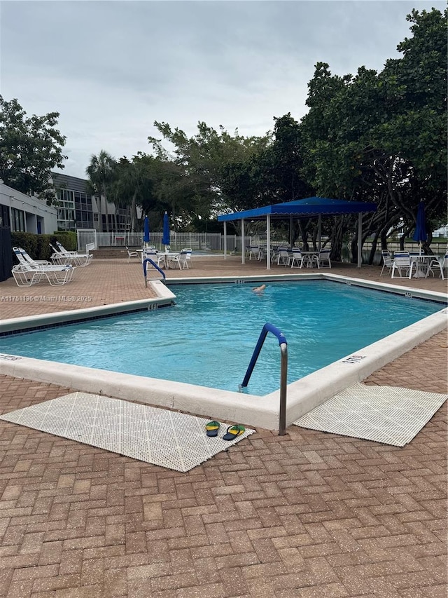 9200 Lime Bay Blvd Unit 212, Tamarac, FL 33321 - pool with a patio area and fence