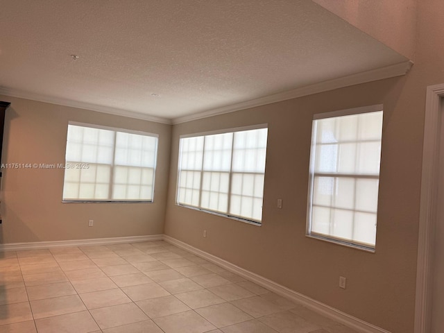 unfurnished room featuring a textured ceiling, ornamental molding, light tile patterned flooring, and baseboards