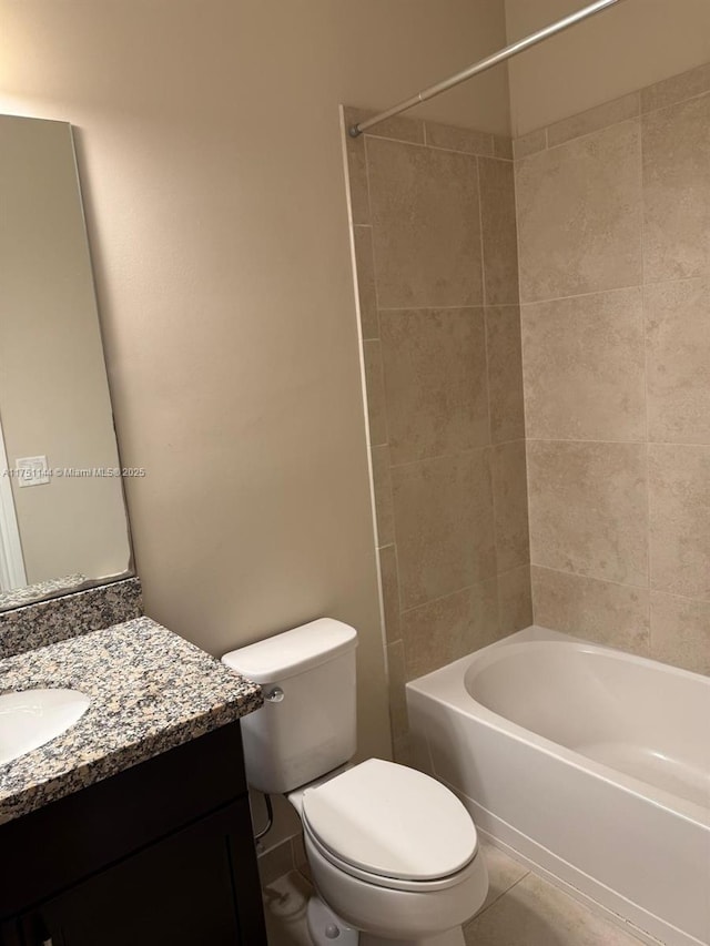 full bathroom featuring shower / washtub combination, tile patterned flooring, vanity, and toilet