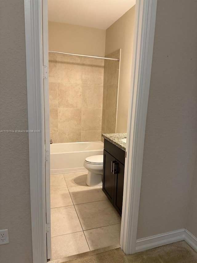 full bath featuring tile patterned flooring, tub / shower combination, vanity, and toilet