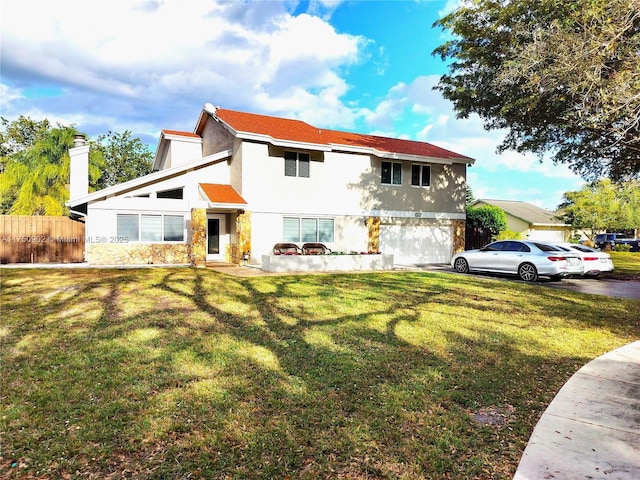 view of front of home with a front yard, fence, and stucco siding