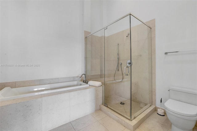 full bath featuring a bath, a stall shower, toilet, and tile patterned floors