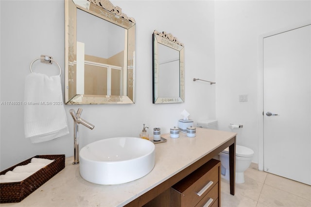 full bath with a stall shower, tile patterned flooring, vanity, and toilet