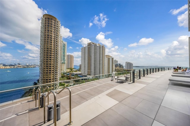 balcony with a view of city and a water view