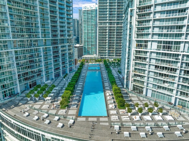 view of swimming pool with a view of city