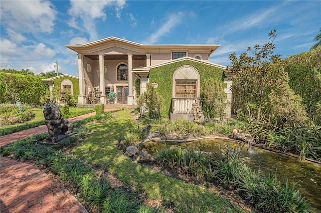 mediterranean / spanish-style home with stucco siding