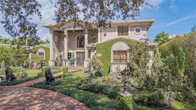 1111 Washington St, Hollywood, FL 33019 - view of front facade featuring a front yard and stucco siding