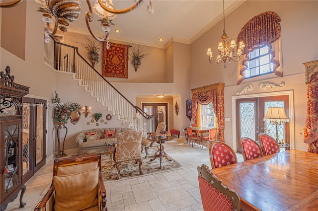 1111 Washington St, Hollywood, FL 33019 - dining area featuring ornamental molding, french doors, a notable chandelier, and stairs