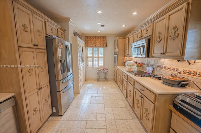 1111 Washington St, Hollywood, FL 33019 - kitchen featuring recessed lighting, light countertops, appliances with stainless steel finishes, tasteful backsplash, and stone tile flooring