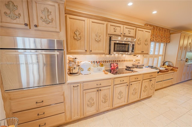 1111 Washington St, Hollywood, FL 33019 - kitchen featuring light brown cabinets, recessed lighting, stainless steel appliances, light countertops, and backsplash