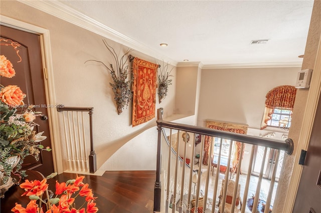 1111 Washington St, Hollywood, FL 33019 - hallway with visible vents, crown molding, an upstairs landing, and wood finished floors