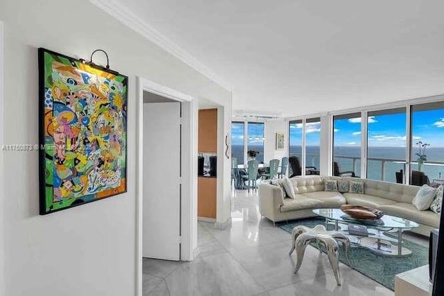 living area featuring expansive windows, a water view, and crown molding