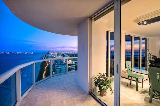 view of balcony at dusk