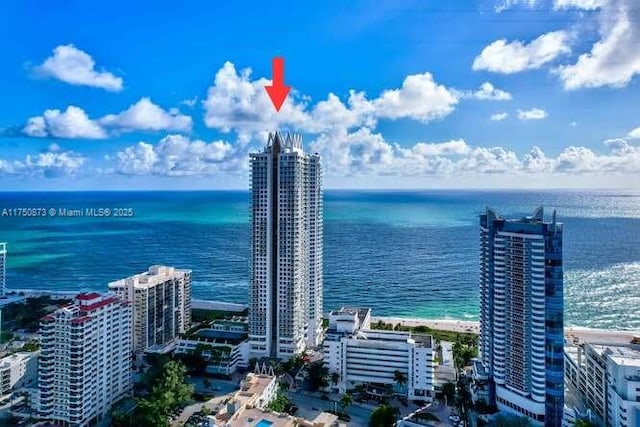 aerial view featuring a water view and a city view