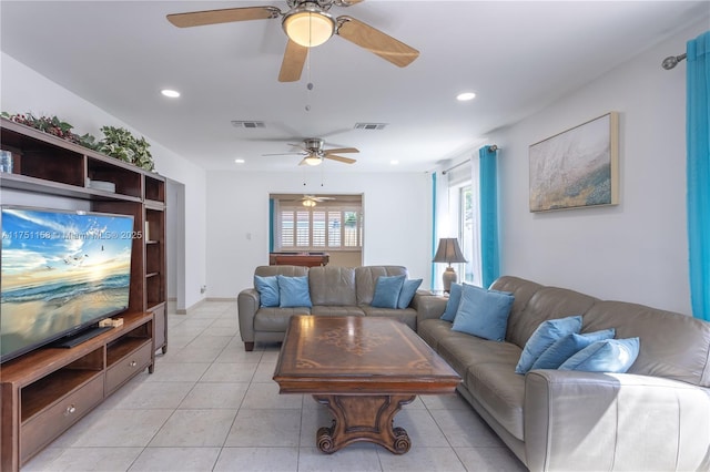 living room featuring light tile patterned floors, visible vents, and recessed lighting