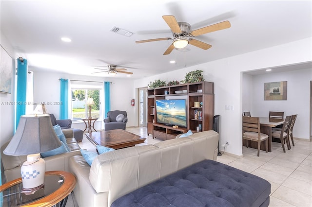 living area with recessed lighting, visible vents, and light tile patterned flooring