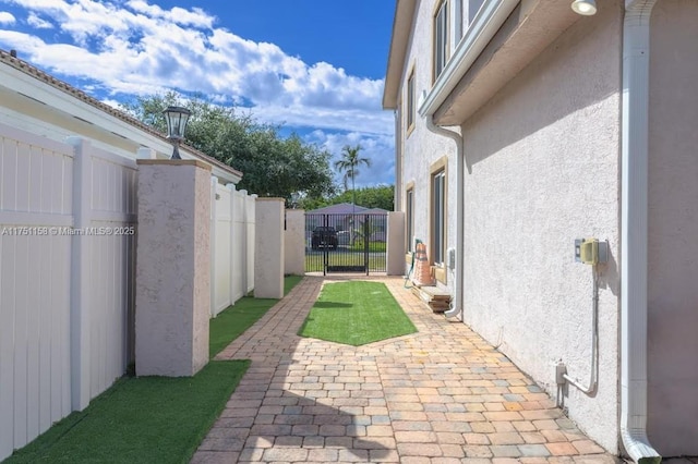 view of patio / terrace featuring fence