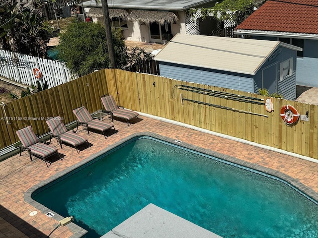 view of swimming pool featuring a patio area and a fenced backyard