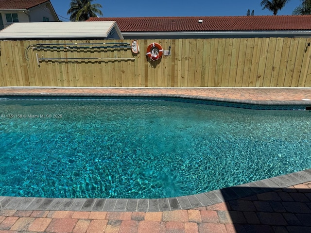 view of pool with fence and a fenced in pool