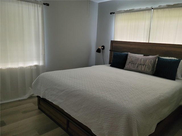 bedroom with wood finished floors