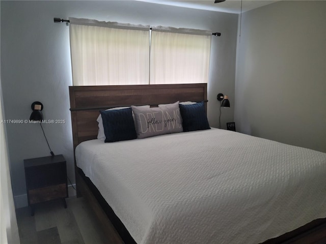 bedroom with wood finished floors