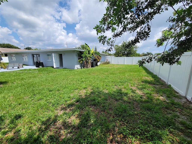 view of yard featuring a fenced backyard and a patio