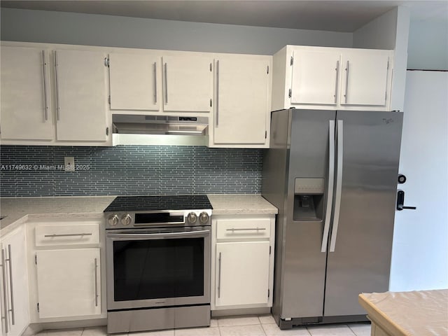 kitchen featuring under cabinet range hood, stainless steel appliances, white cabinets, light countertops, and backsplash