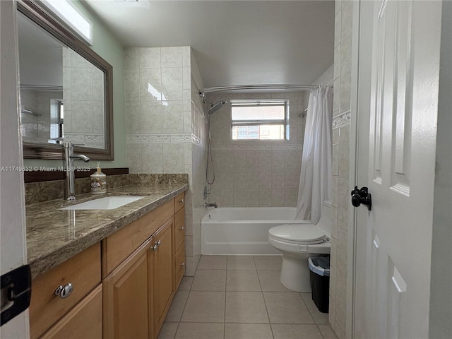 full bath featuring tile patterned flooring, vanity, toilet, and shower / bath combo with shower curtain