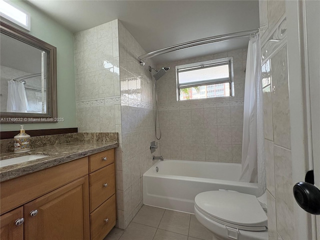 bathroom featuring toilet, tile patterned flooring, shower / bath combo, and vanity