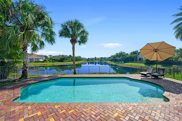 view of pool featuring a fenced in pool, a patio area, a fenced backyard, and a water view