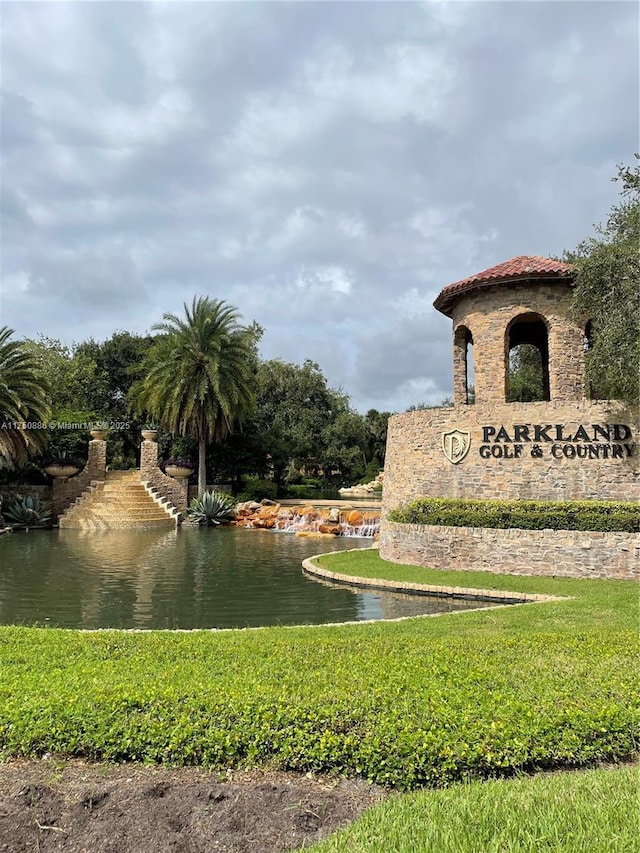 community sign with a water view