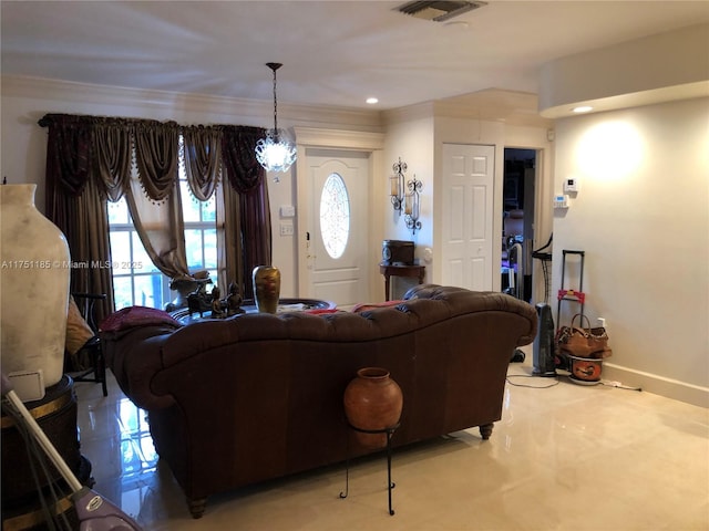 living room with ornamental molding, recessed lighting, visible vents, and baseboards