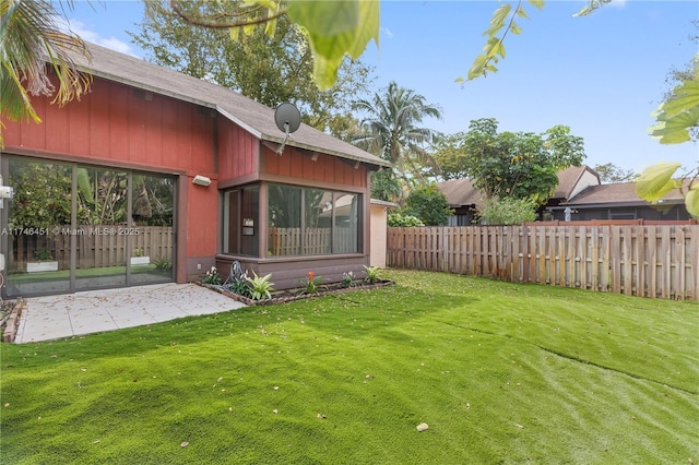 view of yard with a patio and a fenced backyard