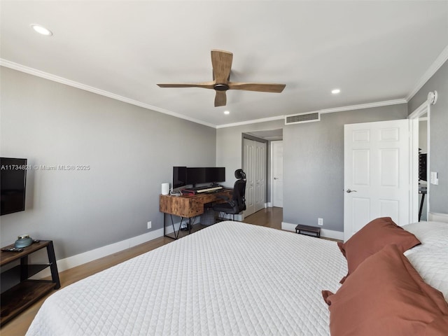 bedroom with visible vents, crown molding, baseboards, recessed lighting, and wood finished floors