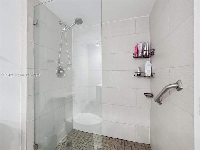 full bathroom with tiled shower