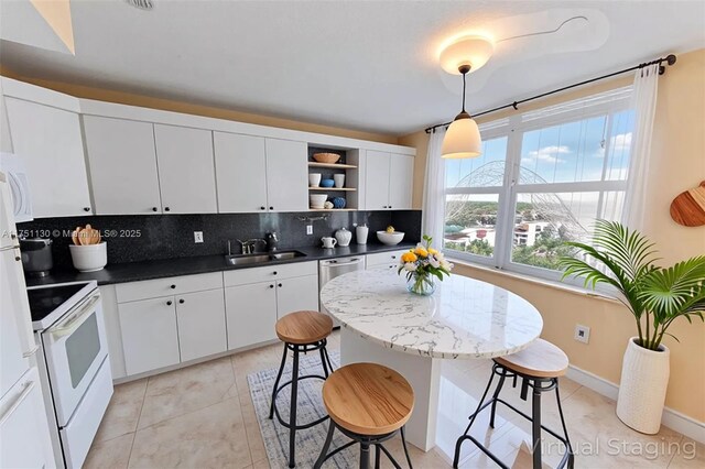 2751 S Ocean Dr Unit 1003N, Hollywood, FL 33019 - kitchen with open shelves, a sink, electric stove, decorative backsplash, and dark countertops
