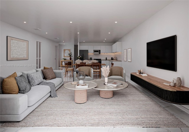 living area featuring marble finish floor and recessed lighting