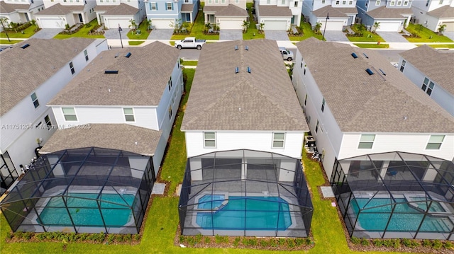 birds eye view of property with a residential view