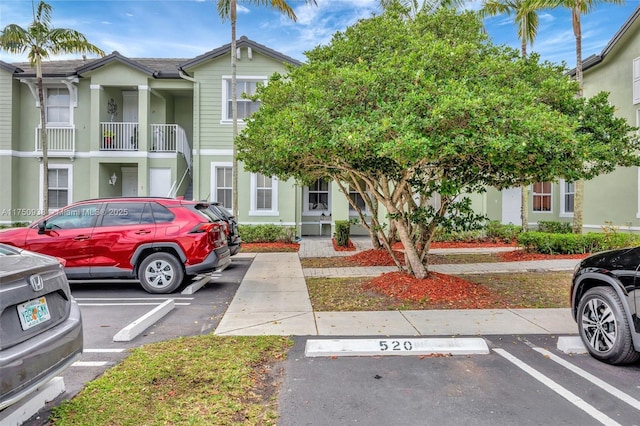 view of front of property featuring uncovered parking