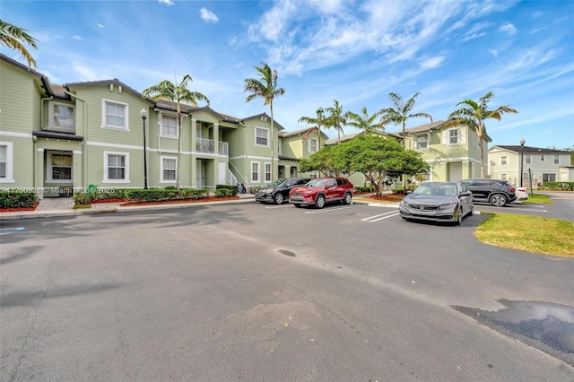 uncovered parking lot with a residential view